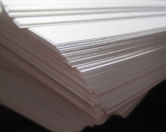 Close up image of a stack of white paper